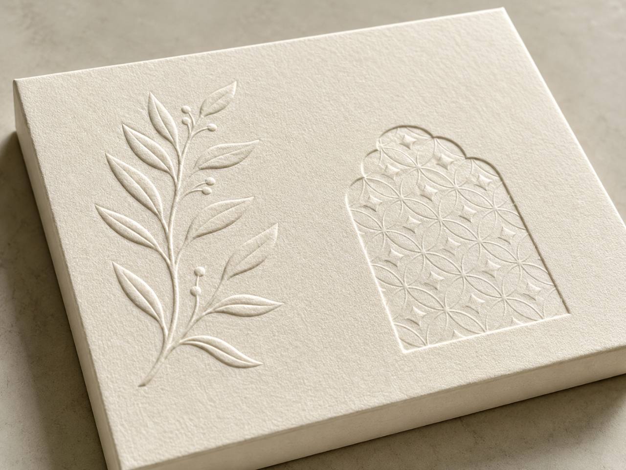 Embossing and debossing details on textured paper
